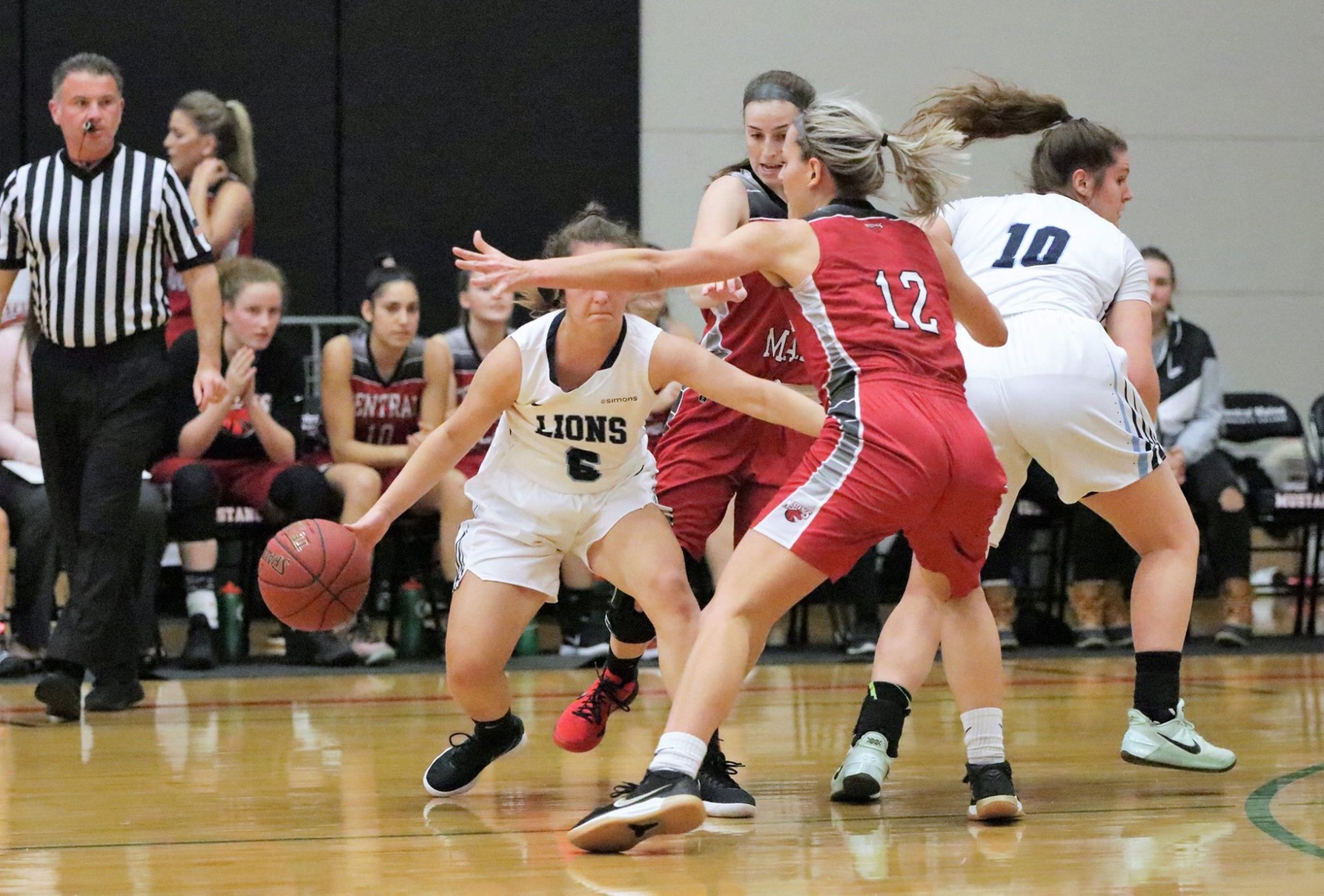Lady Mustangs win first conference road game